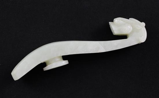 A Chinese pale celadon jade belt hook, 19th century, 9.8cm.